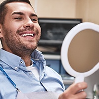 Man smiling at the dentist