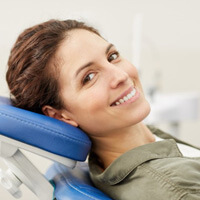 a patient smiling before undergoing dental care