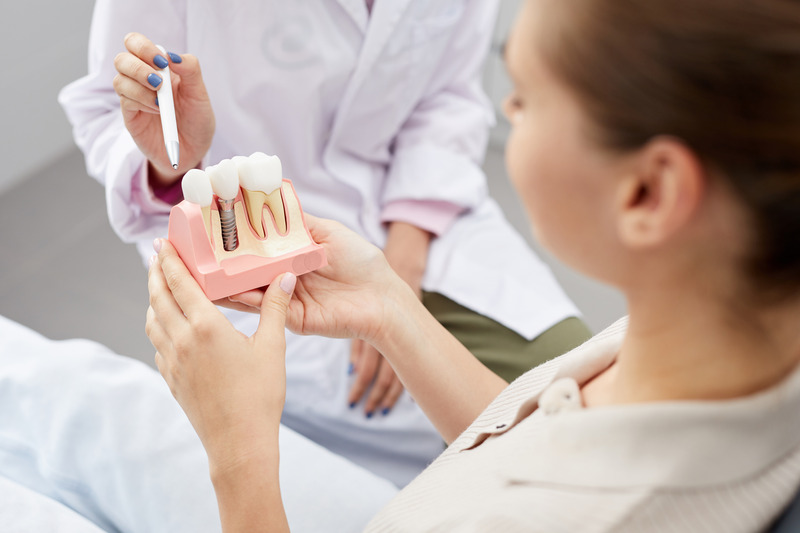 Patient smiling with their dental implants